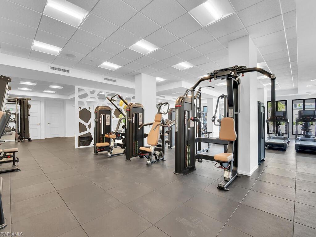 Workout area featuring a drop ceiling