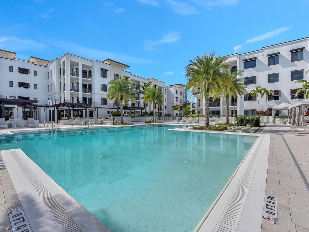Community pool featuring a patio