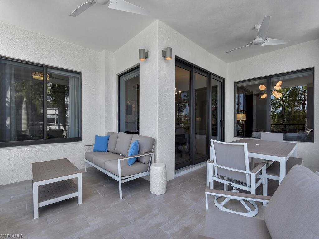 View of patio with ceiling fan and outdoor lounge area