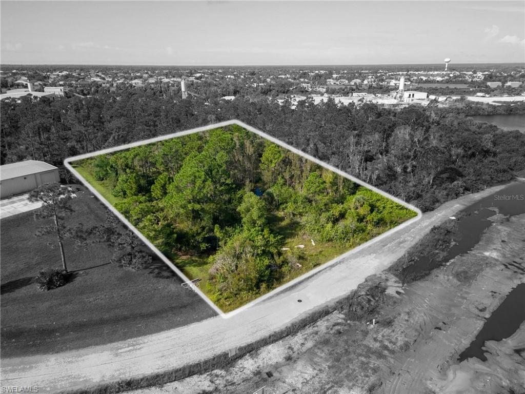 Aerial view of property and surrounding area with property boundaries highlighted