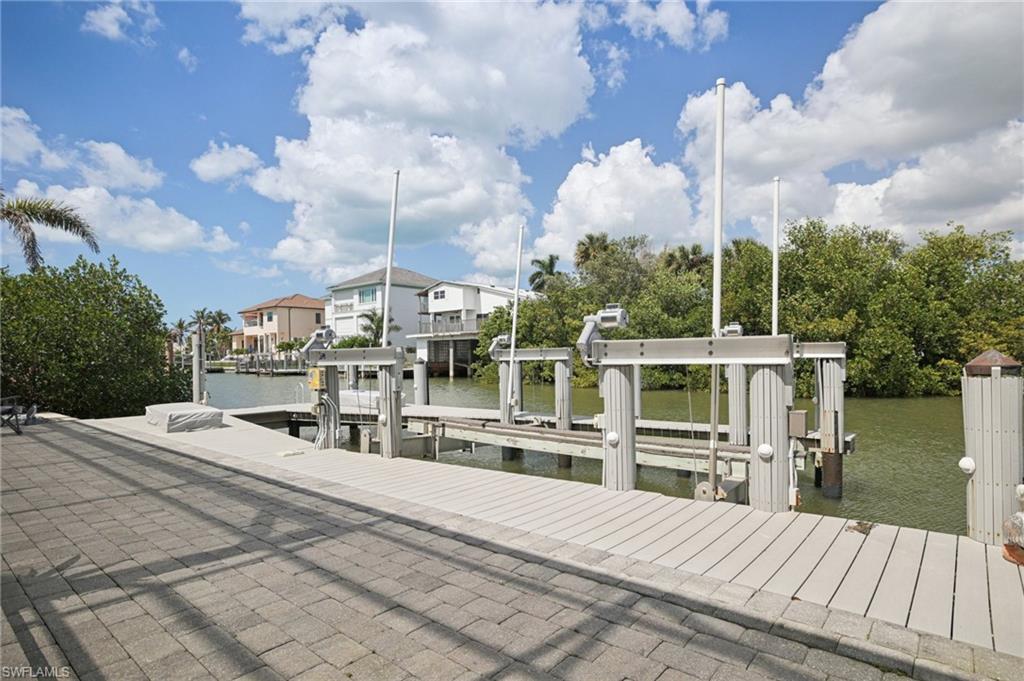 Paver area with attached boat dock featuring 20,000 pound boat lift
