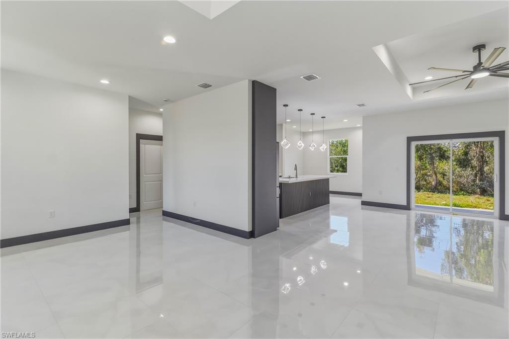 Spare room with ceiling fan and recessed lighting