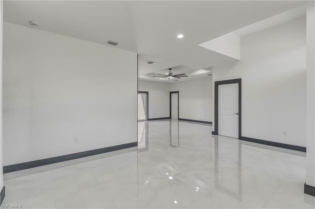 Empty room featuring ceiling fan and recessed lighting