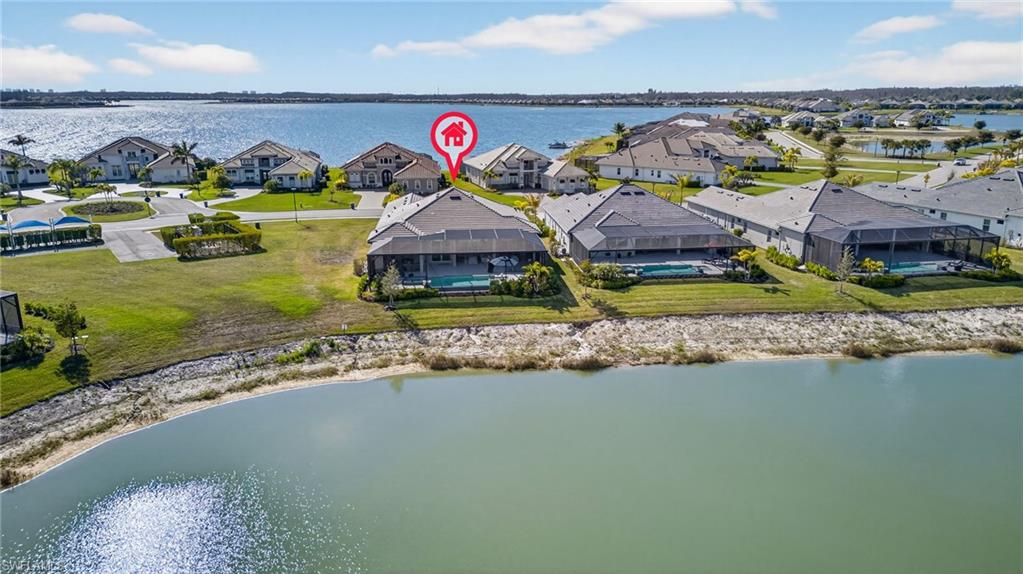 Aerial perspective of suburban area with a nearby body of water