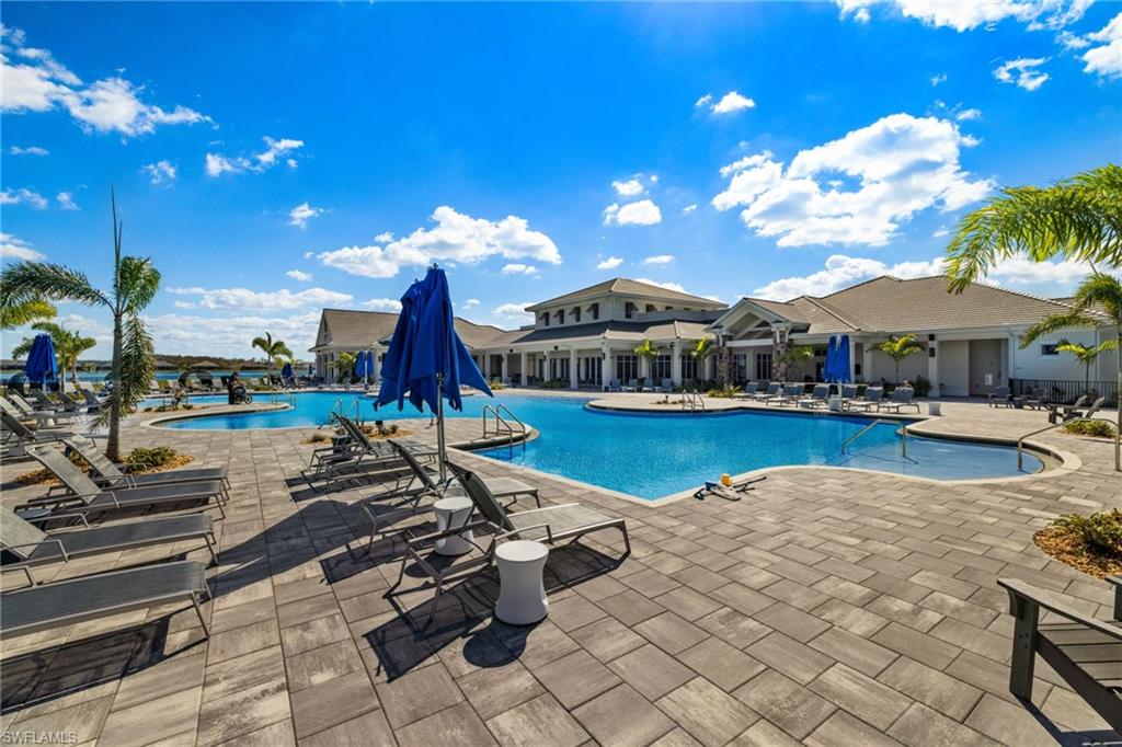 Community pool with a patio area