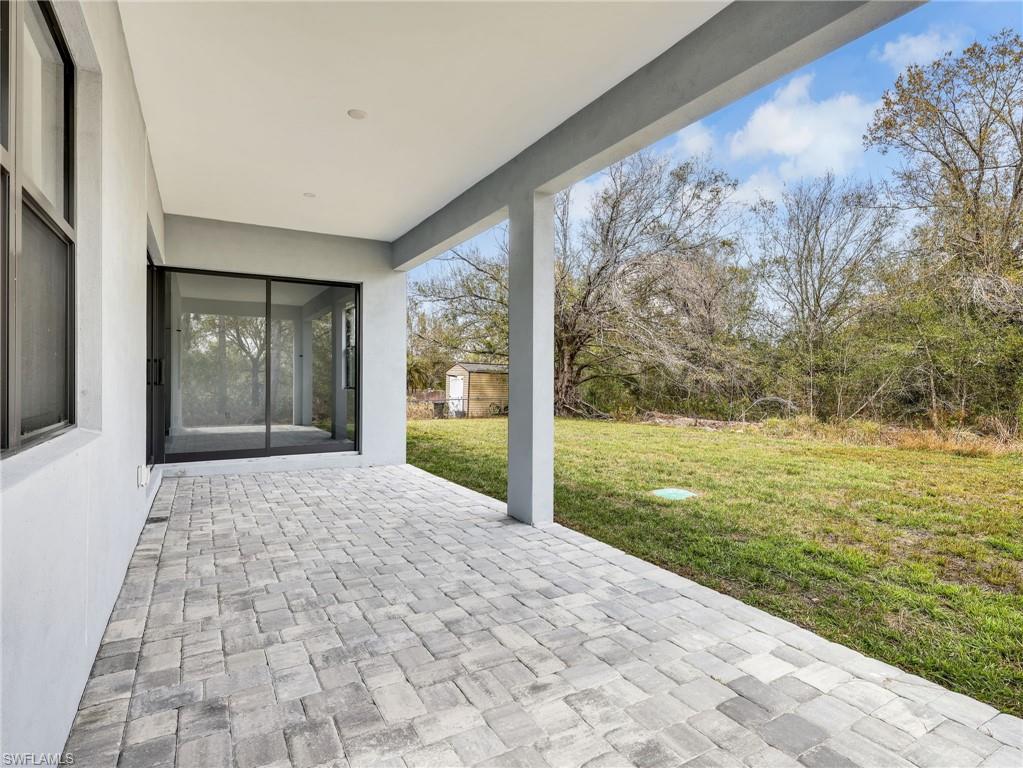 View of patio / terrace featuring a storage unit