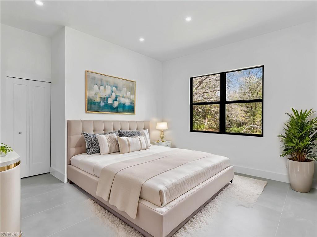 Bedroom featuring baseboards and recessed lighting. This photo is virtually staged. This photo is virtually staged.