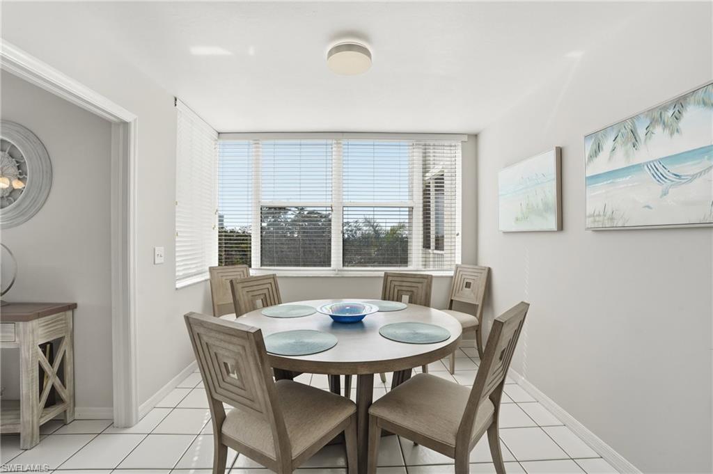 Dining room with light tile patterned floors