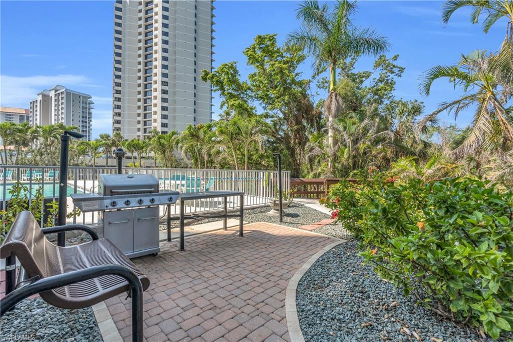 View of patio / terrace featuring grilling area and a community pool