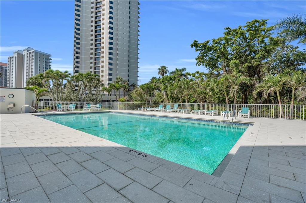 Community pool with a patio