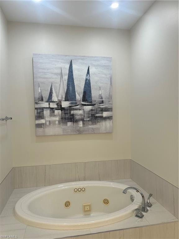 Primary Bathroom with a whirlpool tub and recessed lighting