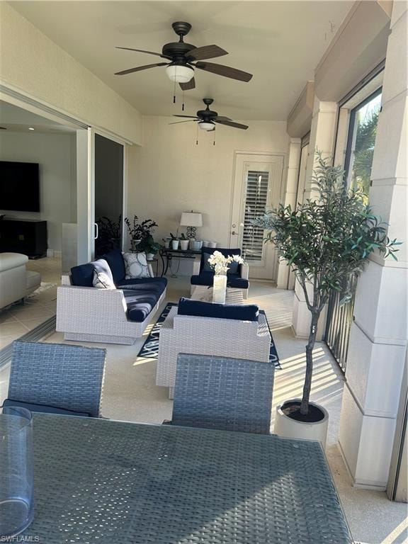 Lanai with ceiling fan and an outdoor living space