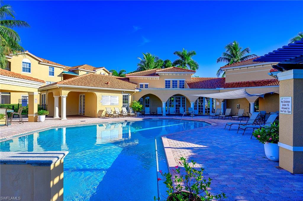 Community pool with a patio area