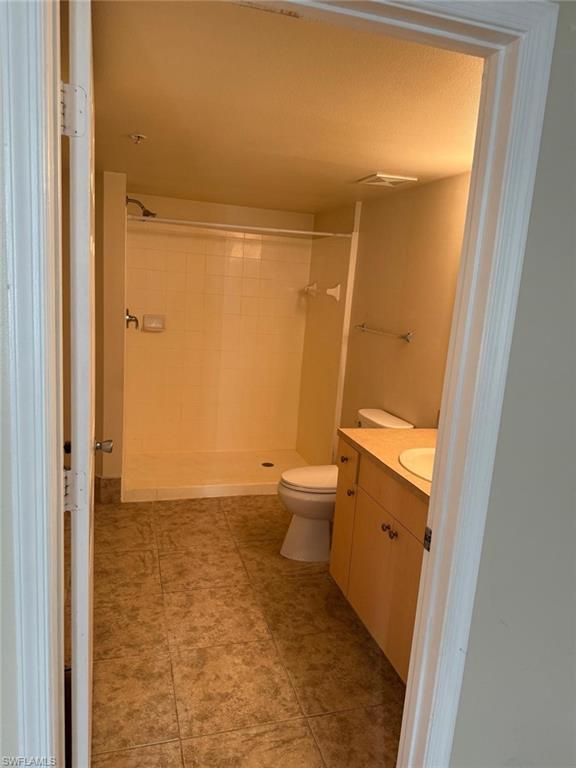 Full bathroom featuring vanity and a shower stall