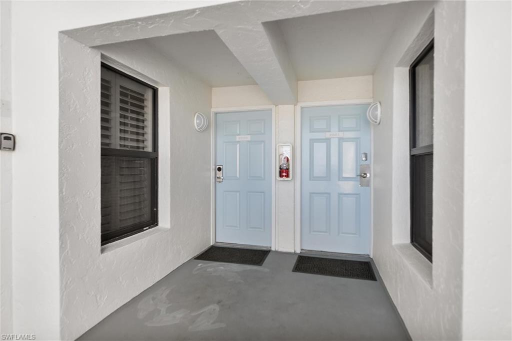 Property entrance with stucco siding