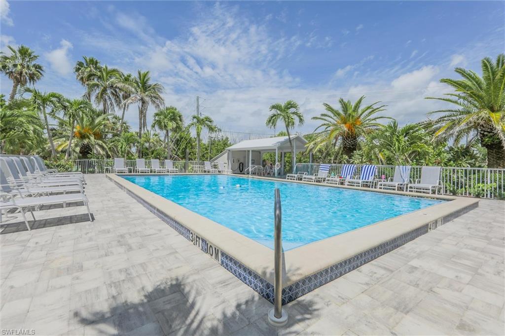 Community pool featuring a patio