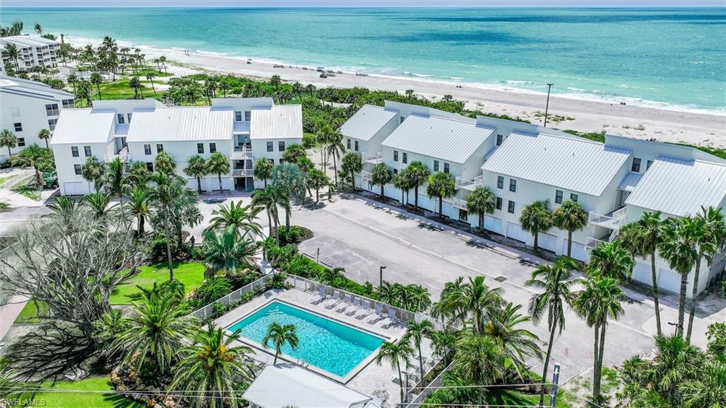 Aerial view of expansive beach and a pool