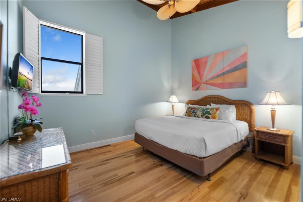 Bedroom with light wood finished floors and ceiling fan