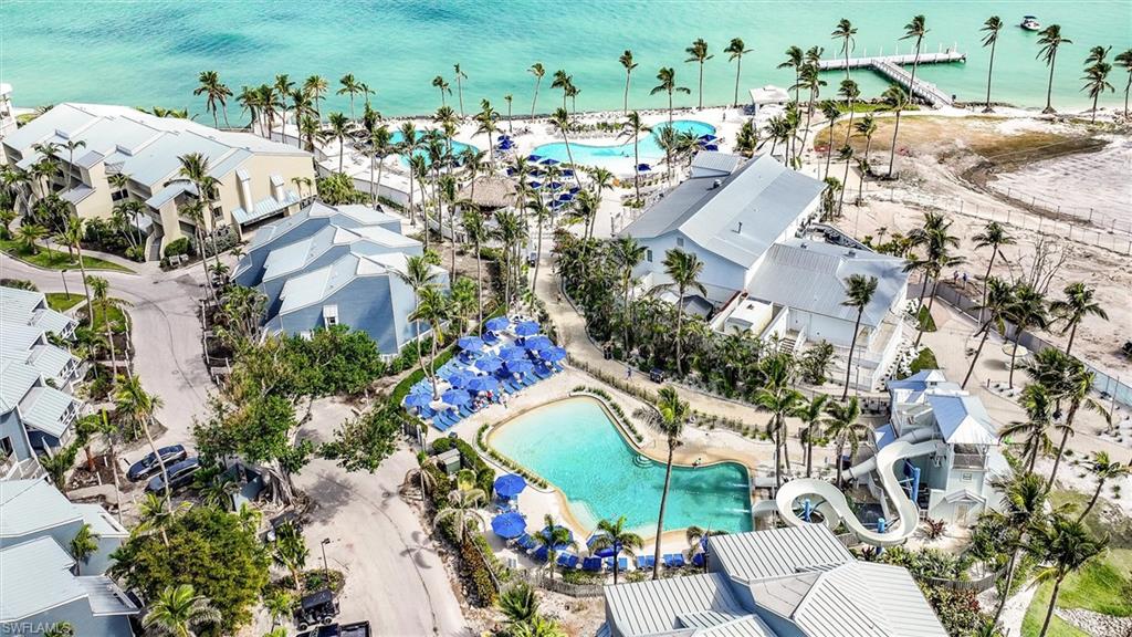 Bird's eye view of a pool area and a large body of water