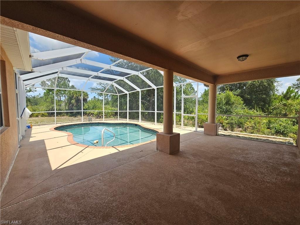 Unfurnished room featuring ceiling fan and light tile floors