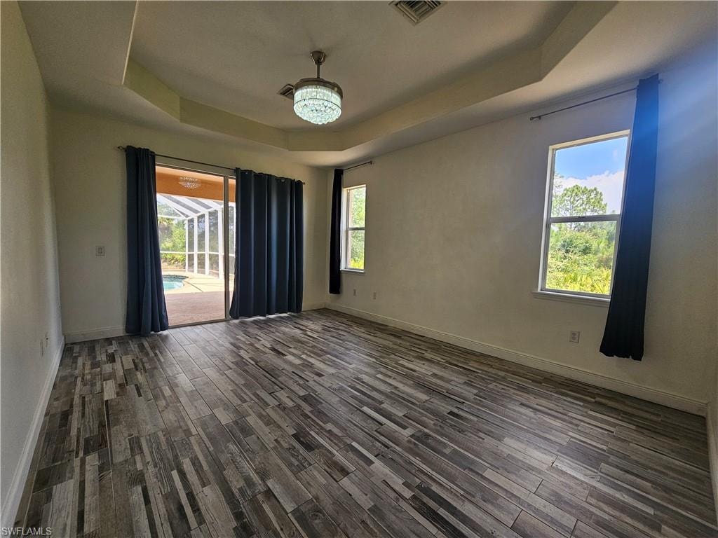 Kitchen island with a light-toned countertop, recessed lighting, tile flooring, glass sliding doors, and a screened outdoor area