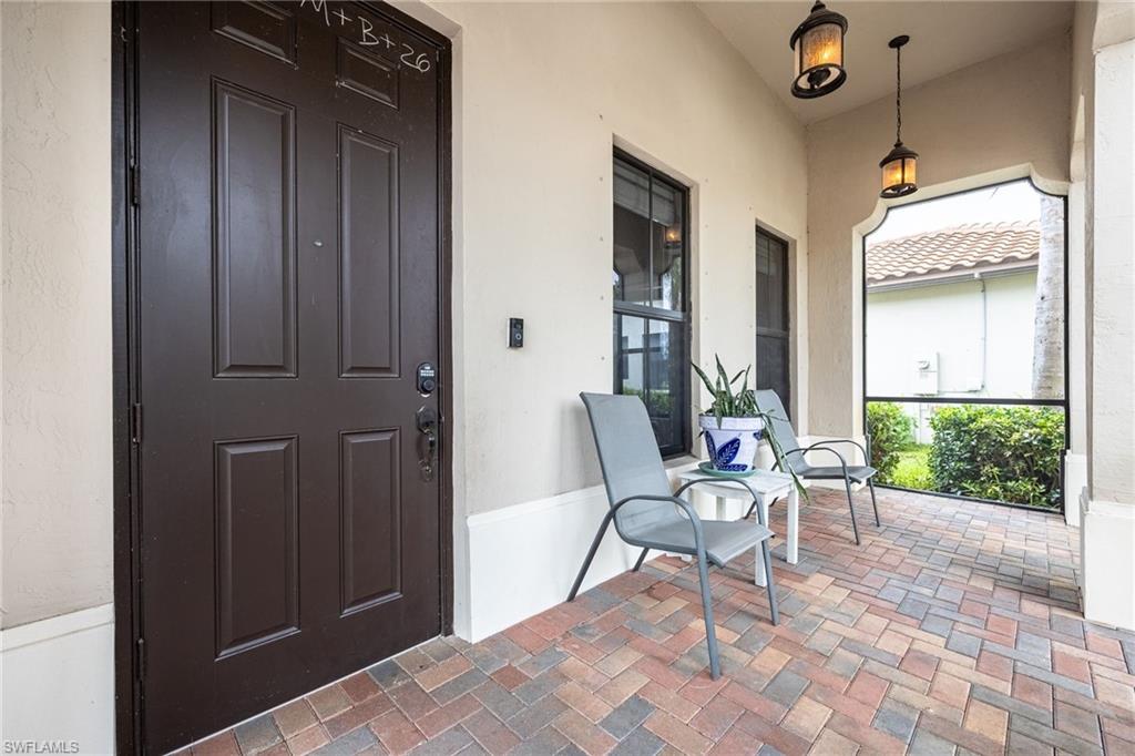 Entrance to property with stucco siding