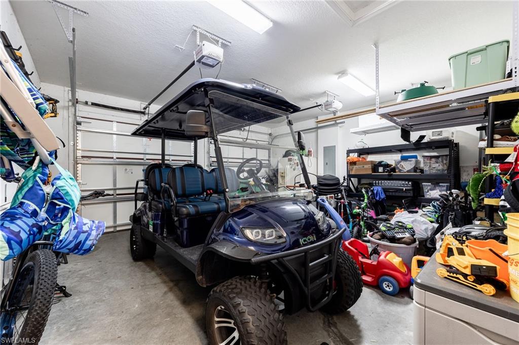 Garage with a garage door opener and electric panel