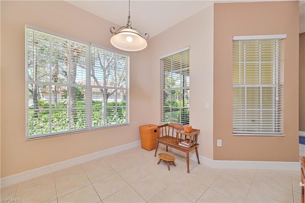 Sitting room with light tile patterned flooring and baseboards