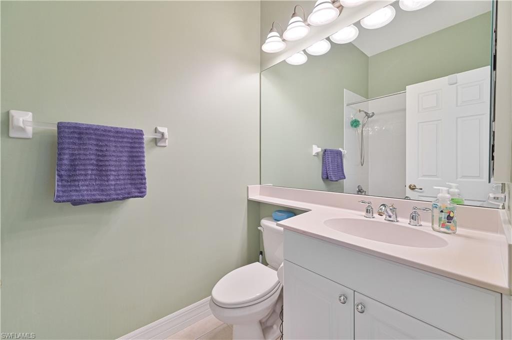 Bathroom featuring vanity and a shower