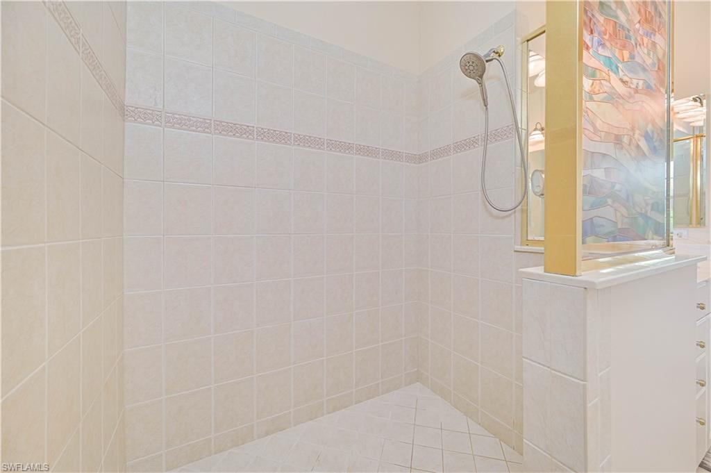 Bathroom with a walk in shower and vanity