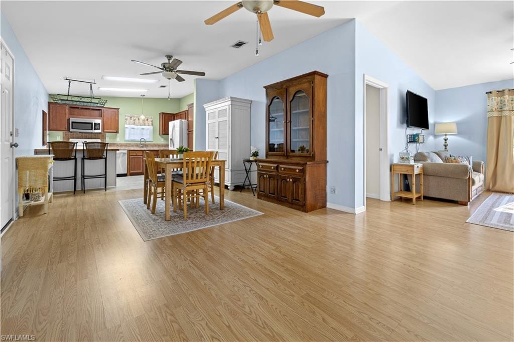 Dining room featuring light wood-style floors and ceiling fan