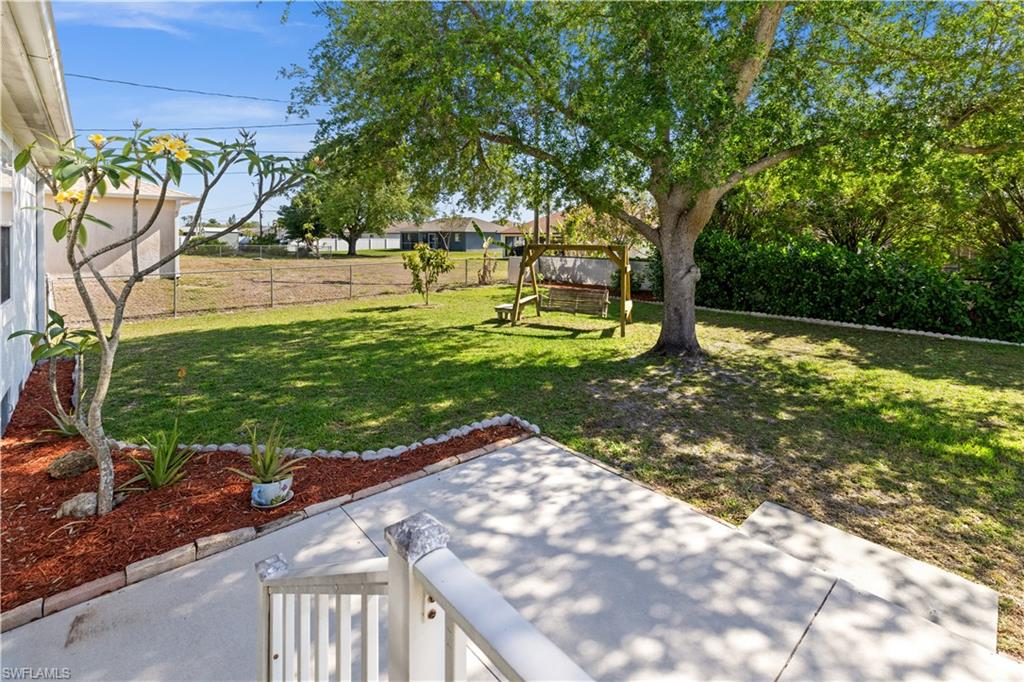 Fenced backyard featuring a patio