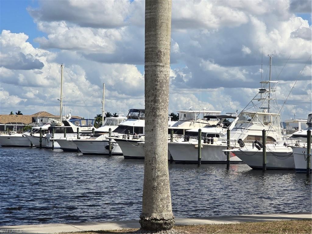 Dock area featuring a view of the boats and water !
