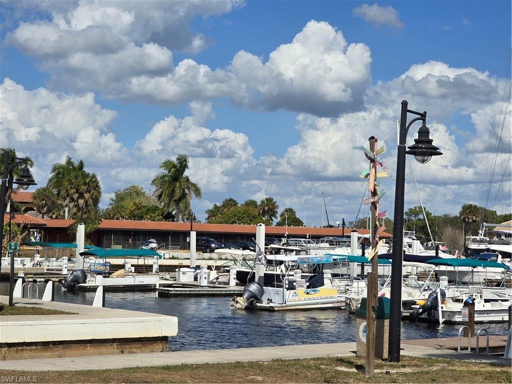 Dock area featuring a water view