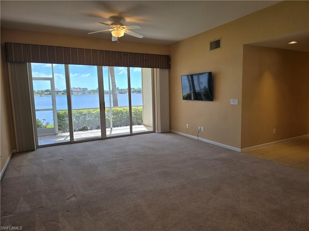 Living area and Screened in Lanai with beautiful view of lake