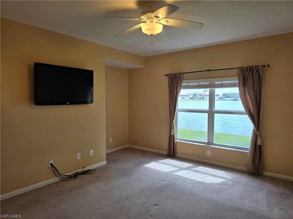Master bedroom room with ceiling fan and light carpet