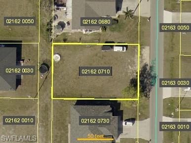 Aerial map of property and surrounding area featuring property parcel outlined
