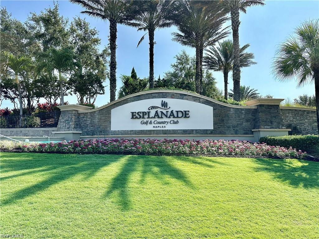 Community sign featuring a lawn