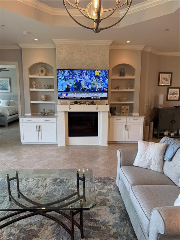Living room featuring crown molding, built in shelves, suspended lighting, and light tile patterned floors