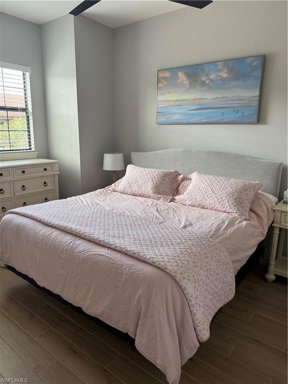 Bedroom featuring dark wood-style floors