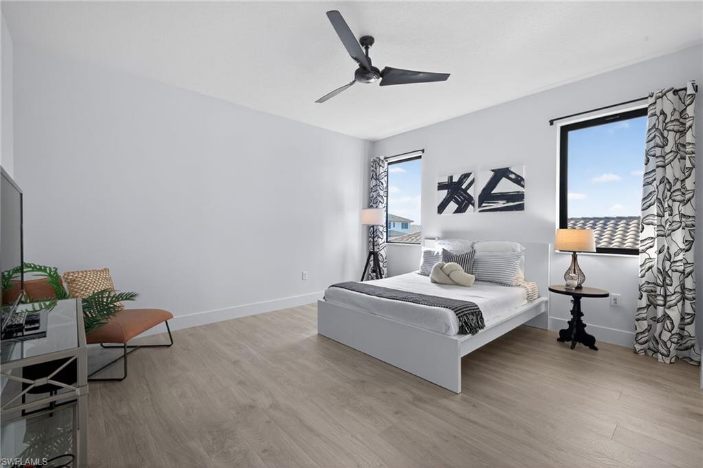 Bedroom featuring a ceiling fan and light wood-style floors