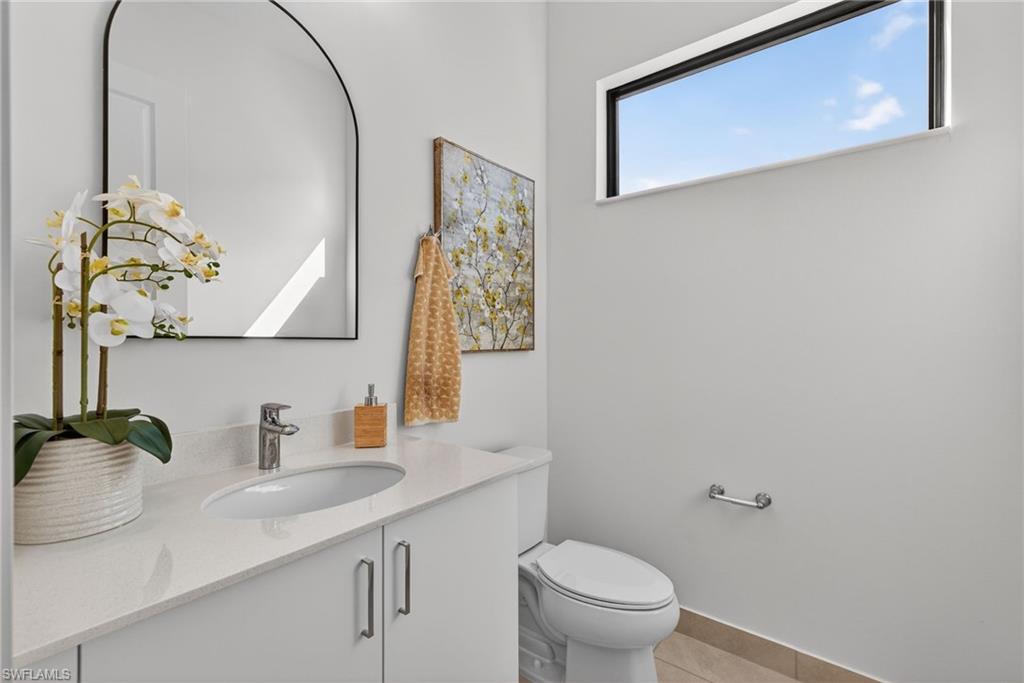 Bathroom with vanity and light tile patterned flooring