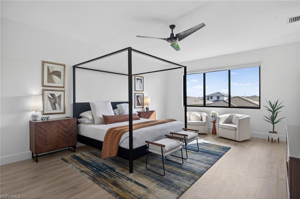 Bedroom featuring light wood-type flooring and ceiling fan