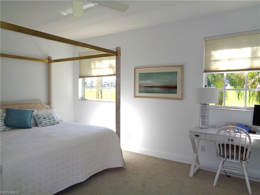 Bedroom with carpet and a ceiling fan