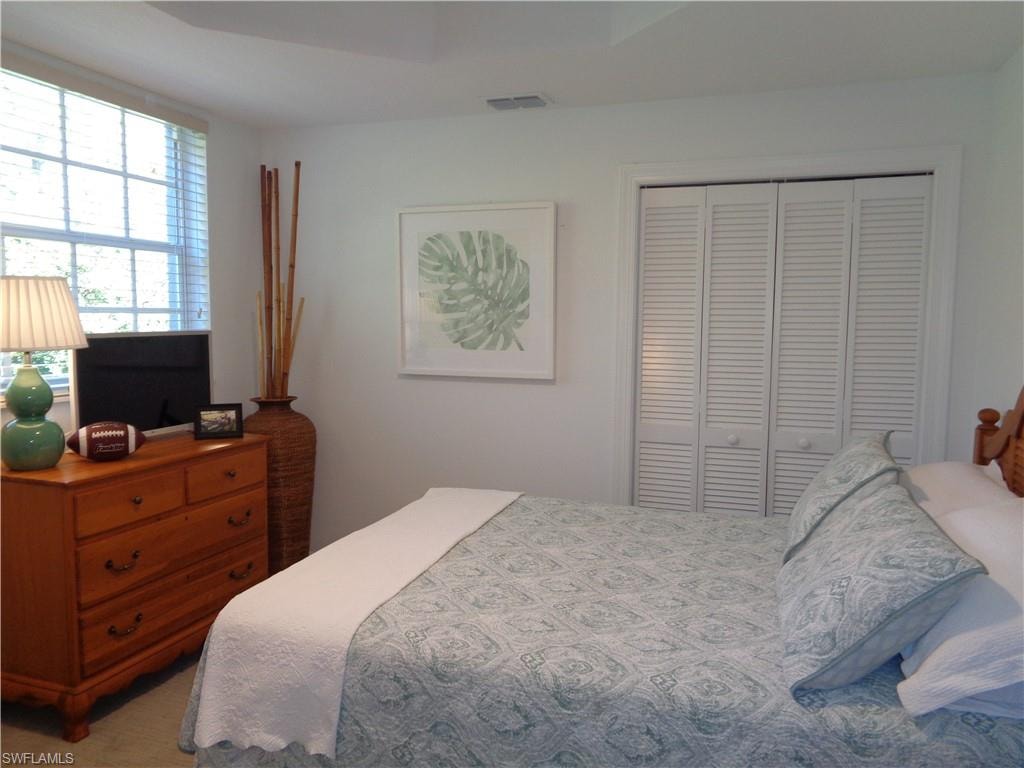 Bedroom with a closet and carpet