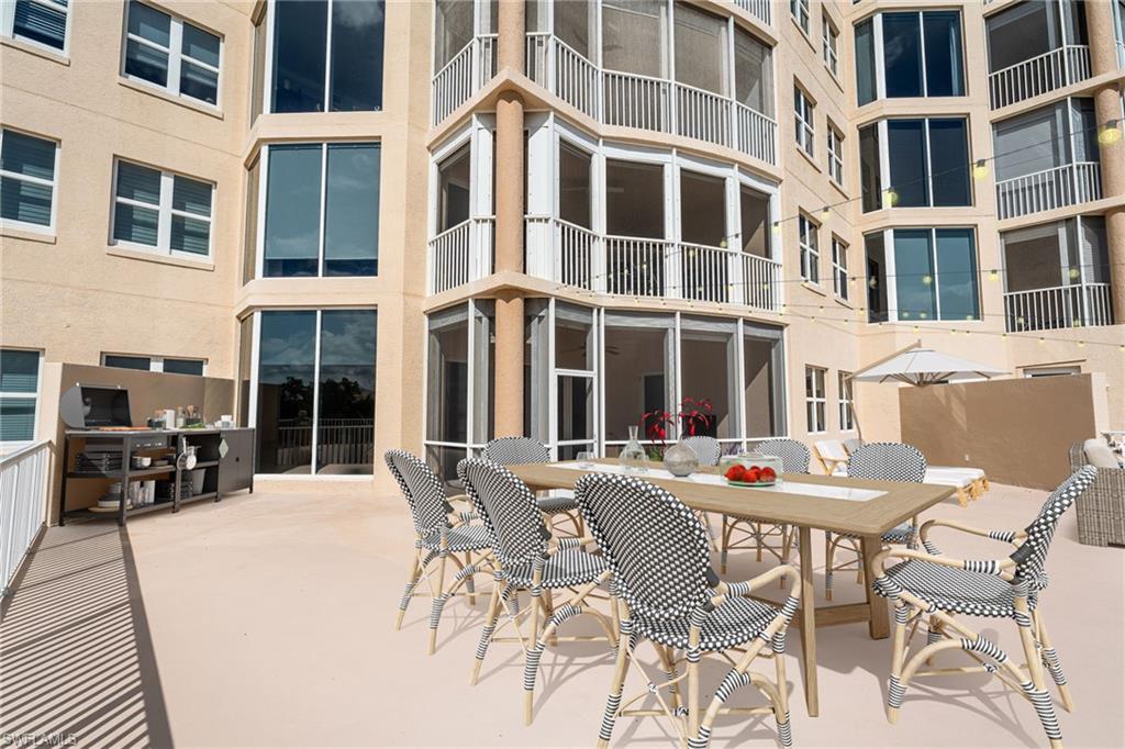 Private 2000 sq ft Patio / Terrace  sunroom, outdoor dining area, and a patio
