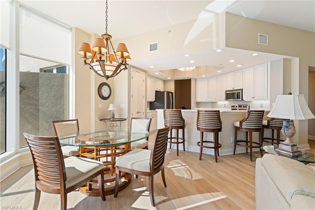 Dining room with a chandelier and light wood-type flooring