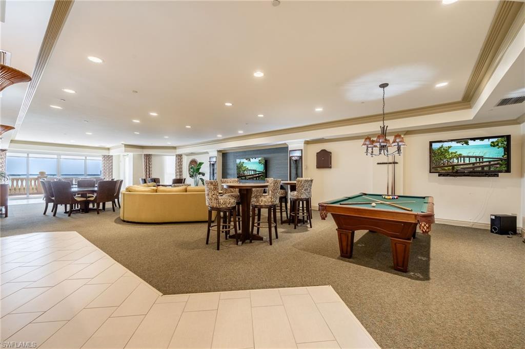 Rec room with billiards, ornamental molding, recessed lighting, and a raised ceiling