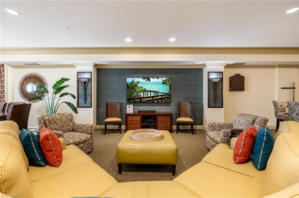 Lobby featuring crown molding, recessed lighting, and wallpapered walls