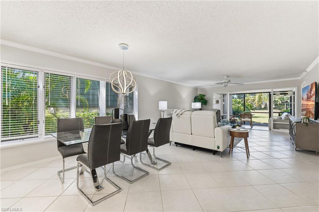 Dining with views to lake, wall of windows offers so much light
